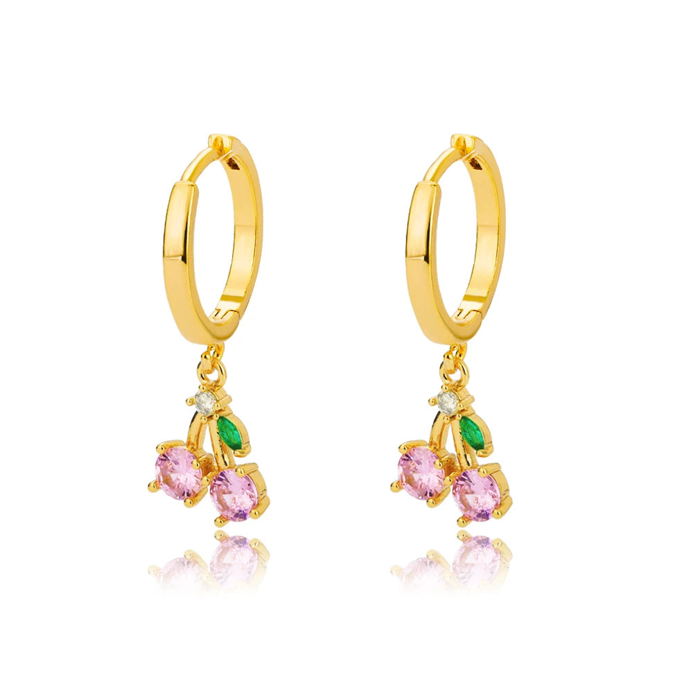 Gold hoop earrings with pink and green gemstones on a white background