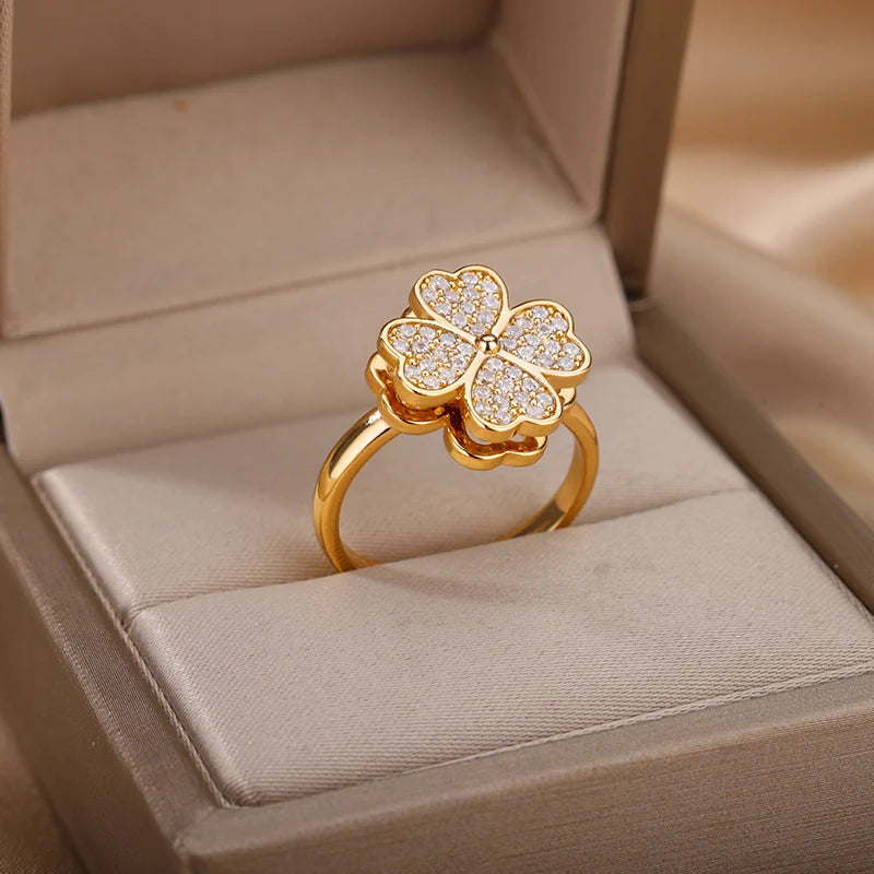 Gold ring with diamond accents in a jewelry box