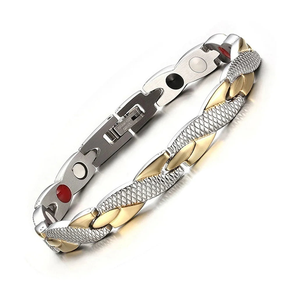 Silver and gold bracelet with red stone on a white background