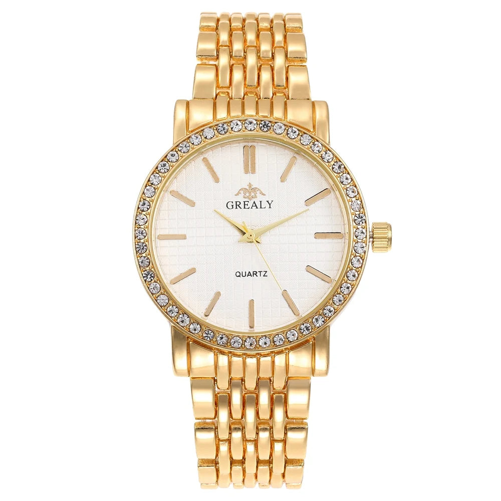 Gold wristwatch with a white face and visible brand name on a white background