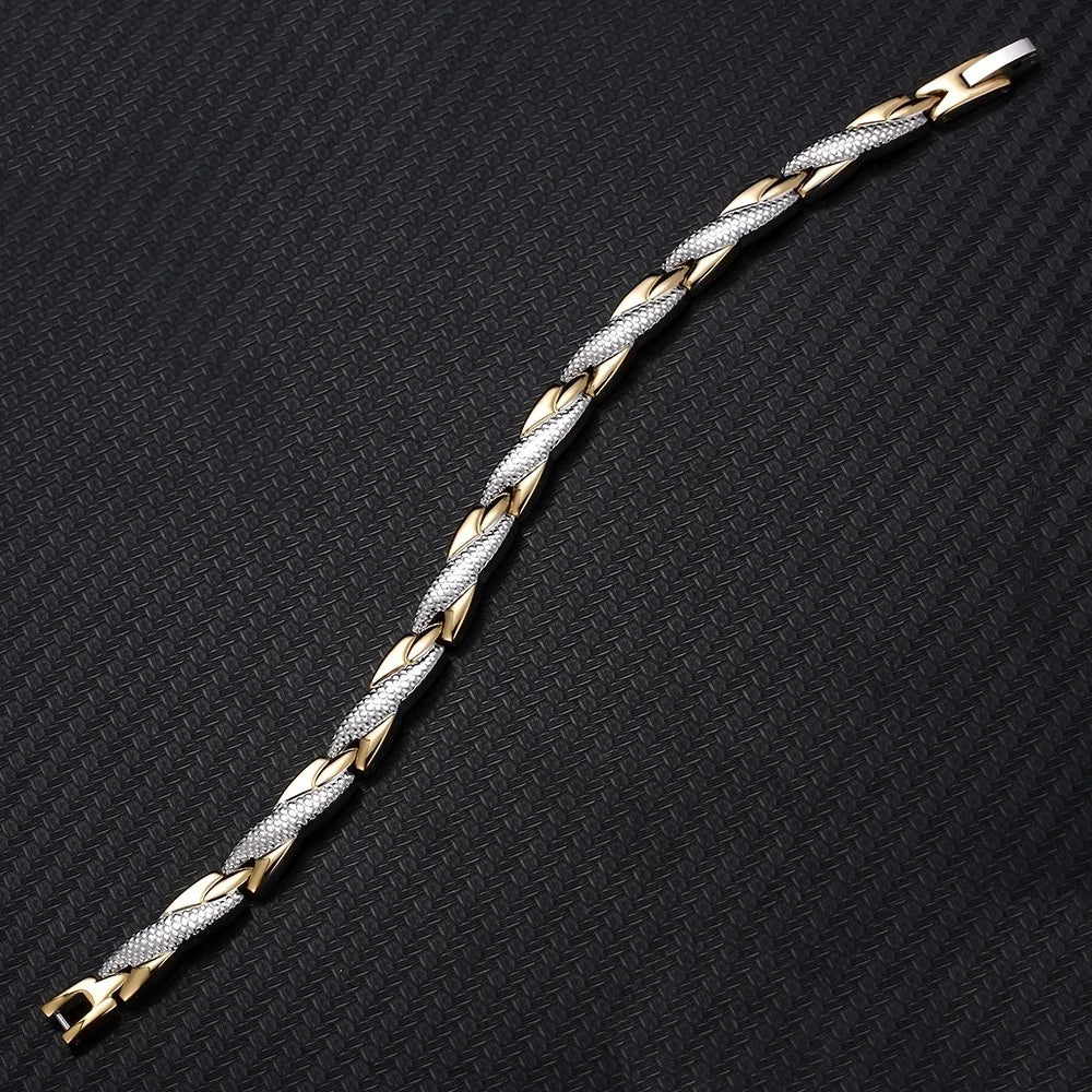 Two-tone gold and silver braided bracelet on a black textured background